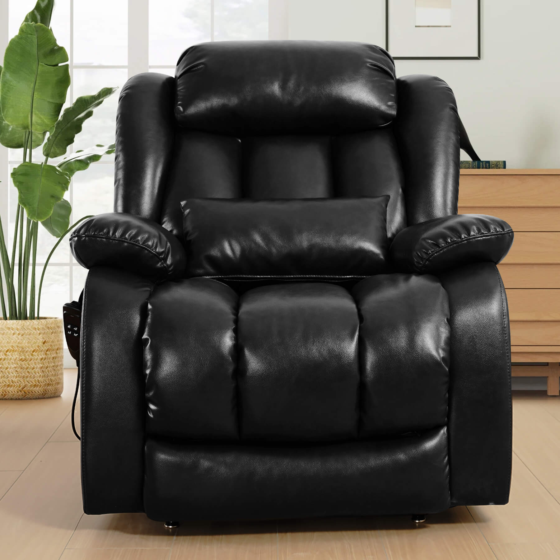 Black leather recliner chair in a living room setting, facing forward.